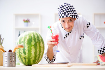Fototapeta premium Male cook with watermelon in kitchen