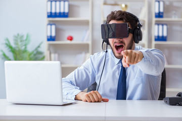 Businessman gamer in office playing games