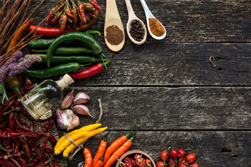 Various spices on old wooden, room for text. toned image.  