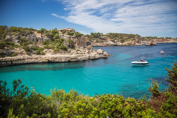 Blue Lagoon with a boat. Cala Llombards