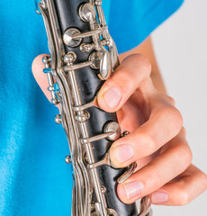 Fototapeta premium Close-up photo of clarinet in the hands of boy