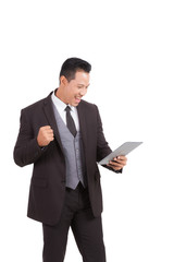 Businessman looking to tablet checking e-mail or shopping online on isolated background.