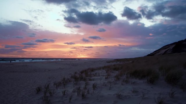 Sunrise over beach in Cape Cod in real time