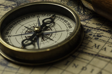 Retro compass with old map