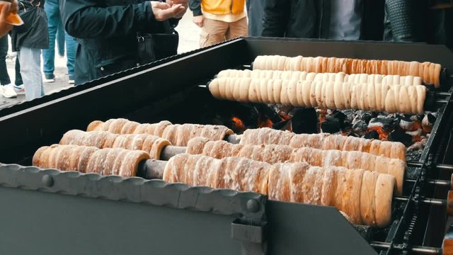 National Czech trdelnik sweet delicacy that prepared on the street.Traditional Czech and Hungarian sweet bakery trdelnik cooked on the street of Prague.