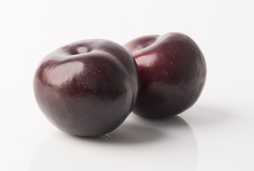 Ripe plum fruit on a background