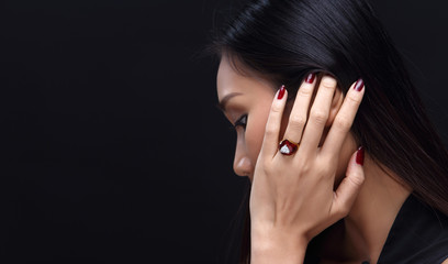 Beauty Fashion Glamour Asian Girl Portrait over black background.