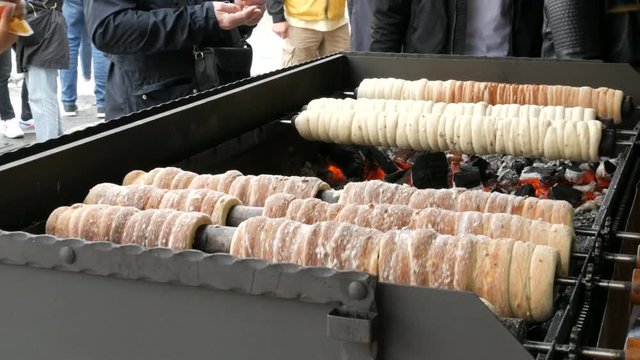 National Czech trdelnik sweet delicacy that prepared on the street.Traditional Czech and Hungarian sweet bakery trdelnik cooked on the street of Prague.