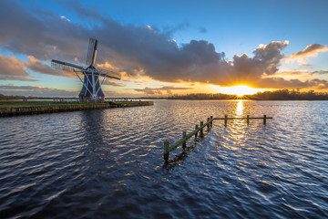 wooden windmill on the waterfront