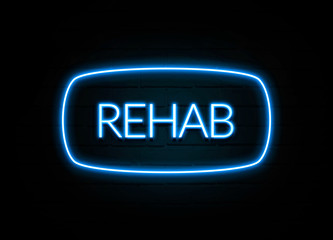 Rehab  - colorful Neon Sign on brickwall