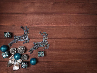 Beautiful Christmas composition on wooden background. Place for inscription on the right.