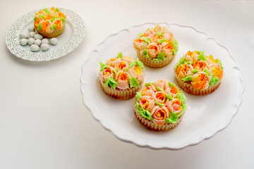 Top view decorated cupcakes with Easter eggs on white Background.