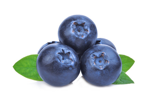 stack of blueberries with green leaves isolated on white background