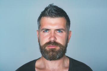 Guy with beard, mustache on serious face