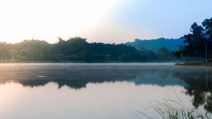The landscape of lake at Pindaya town, Myanmar in the morning time with the sunrise and the mirror lake