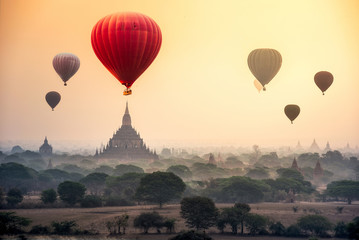Hot air balloon over plain of Bagan in misty morning, Mandalay, Myanmar
