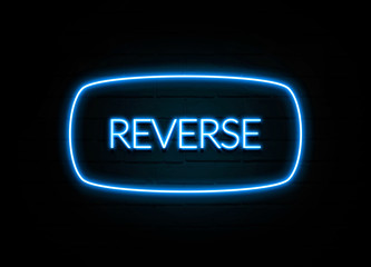 Reverse  - colorful Neon Sign on brickwall