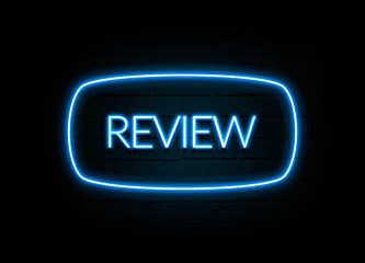 Review  - colorful Neon Sign on brickwall