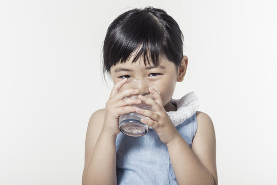 Pretty Asian Girl Hand Holding A Cup Of Water With Smile Isolated White.