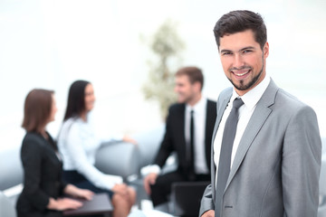 Fototapeta premium portrait of successful businessman on background of office