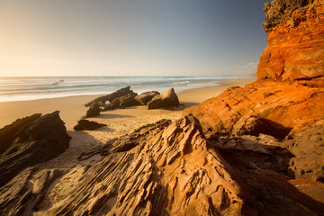 Fototapeta na wymiar Praia da Bordeira, Algarve, Portugal. Red stone.
