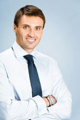Portrait of business man, over blue background
