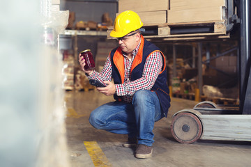 Warehouse worker scanning box