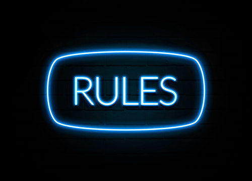 Rules  - colorful Neon Sign on brickwall