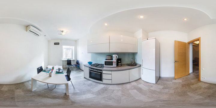 Panorama in interior of modern kitchen in light color style.  Full 360 by 180 degree seamless spherical panorama in equirectangular equidistant projection. VR content