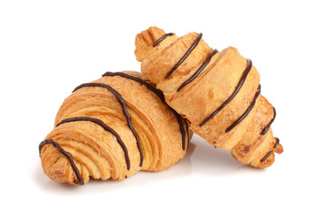 croissant decorated with chocolate sauce isolated on white background, top view
