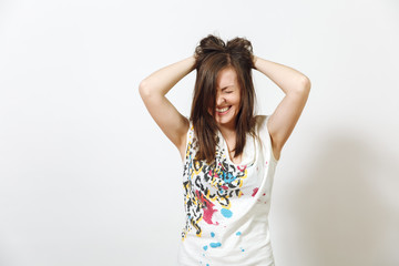 Fototapeta premium Beautiful European young funny and cheerful brown-haired woman with healthy clean skin, dressed in casual light clothes is fooling around at camera, on a white background. Emotions concept.