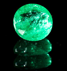 green gem on a black background.