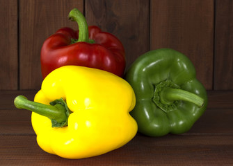 Juicy beautiful Bulgarian pepper on a wooden background