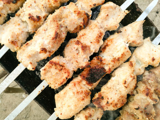 Shish kebab on metal sticks roasted on the grill