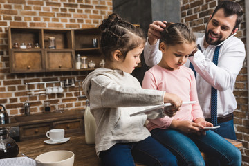 father and daughters preparing in morning