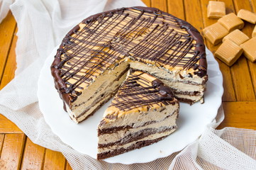 Caramel cake with triangle shaped slice
