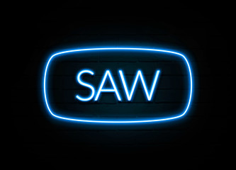 Saw  - colorful Neon Sign on brickwall