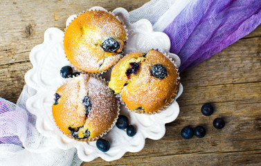Homemade blueberry muffins on a wooden table