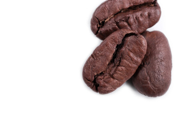  cracked grains of black fried coffee