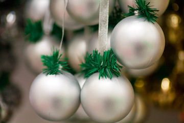 Naklejka na ściany i meble Multicolored bright shiny Christmas decorations ornaments for a Christmas tree on a Christmas and New Year holiday