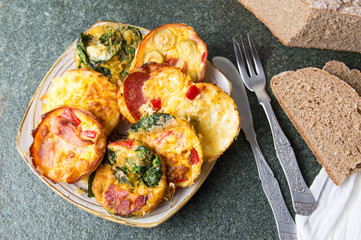 Creative baked egg meal with various ingredients