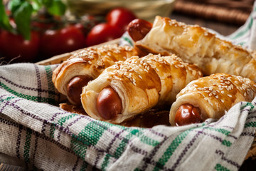 Rolled hot dog sausages baked in puff pastry
