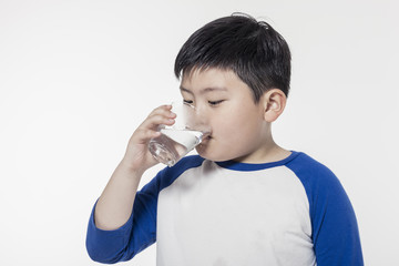healthy asian boy hand hold a cup of water isolated white.