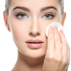  Girl removes makeup cotton ball from face