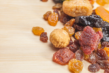 Dried fruit mix on wooden background  with copy space