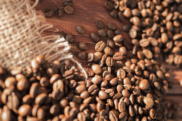 coffee beans on a table with burlap.