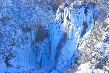 Fototapeta na wymiar Plitvice lakes, National park in Croatia, winter landscape with frozen waterfalls