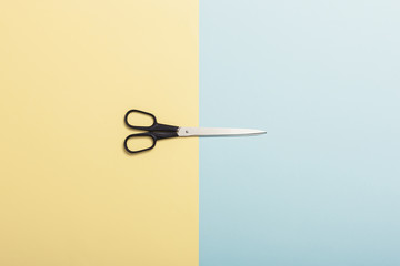 scissors on the color paper background.