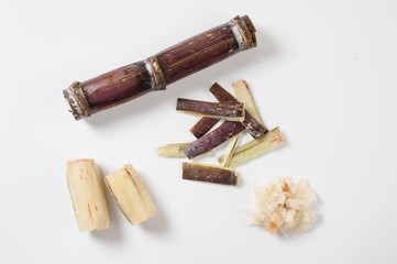 Sugar cane condiments on white table
