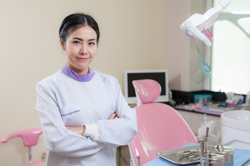 Female dentist crossing armin dental clinic